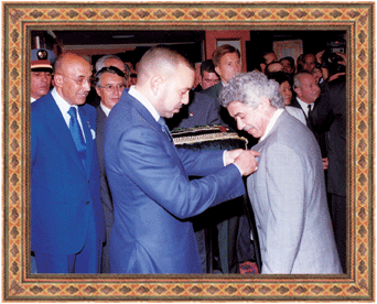 Dr. Hamid Mernissi with His Majesty Mohamed VI, King of Morocco, receiving the Wissam Chevalier of Al Mukafaa Alwatania award